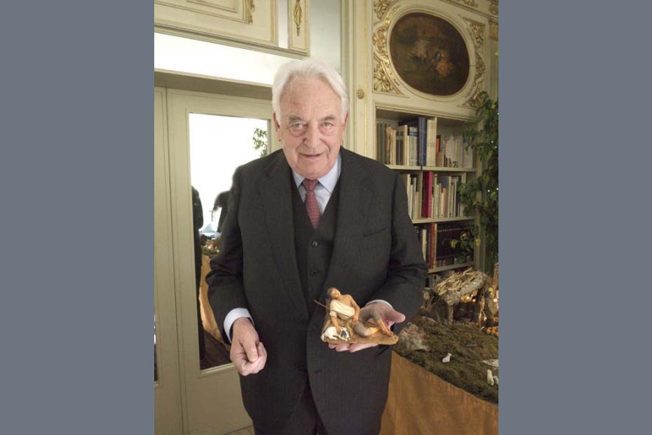 Carlo holds the presepe figure of Benito, the sleeping shepherd.