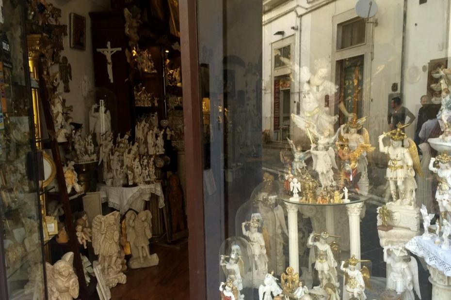 A shop in Monte Sant'Angelo features an array of statues of San Michele, the Archangel.