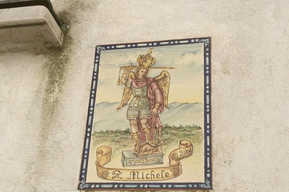 San Michele above a door in the streets of Sant'Angelo below the shrine.