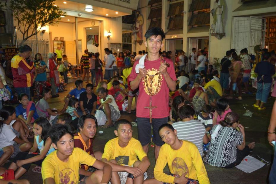 Young people at the Quaipo church, home of the statue of the Black Nazarene. They chose this as one of the seven churches they visited for the Visita Iglesia devotion on Holy Thursday, 2015. Photo by Arnulfo Valderama Fortunado.