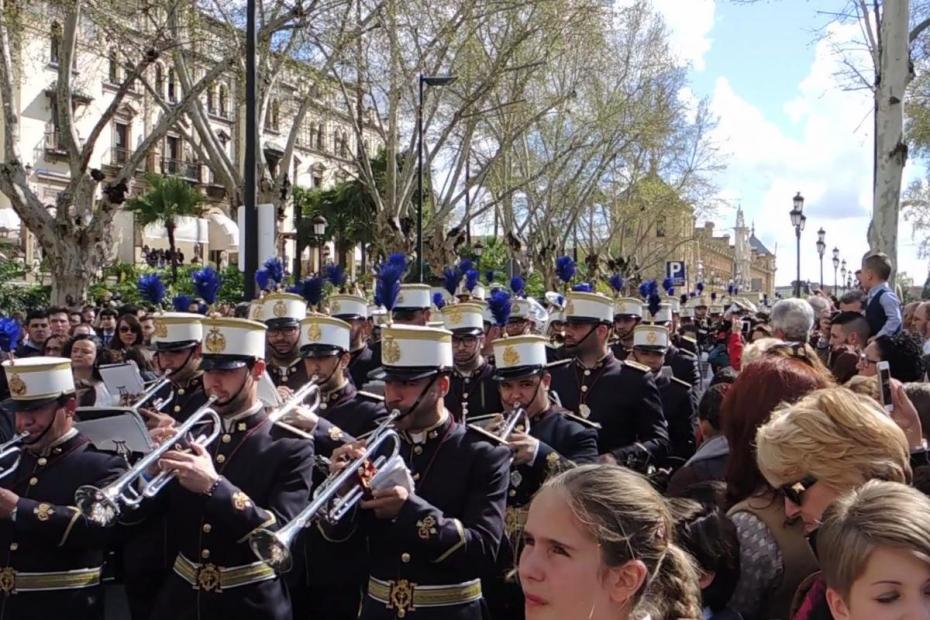 Musicians with La Paz Brotherhood process on Palm Sunday in Seville.