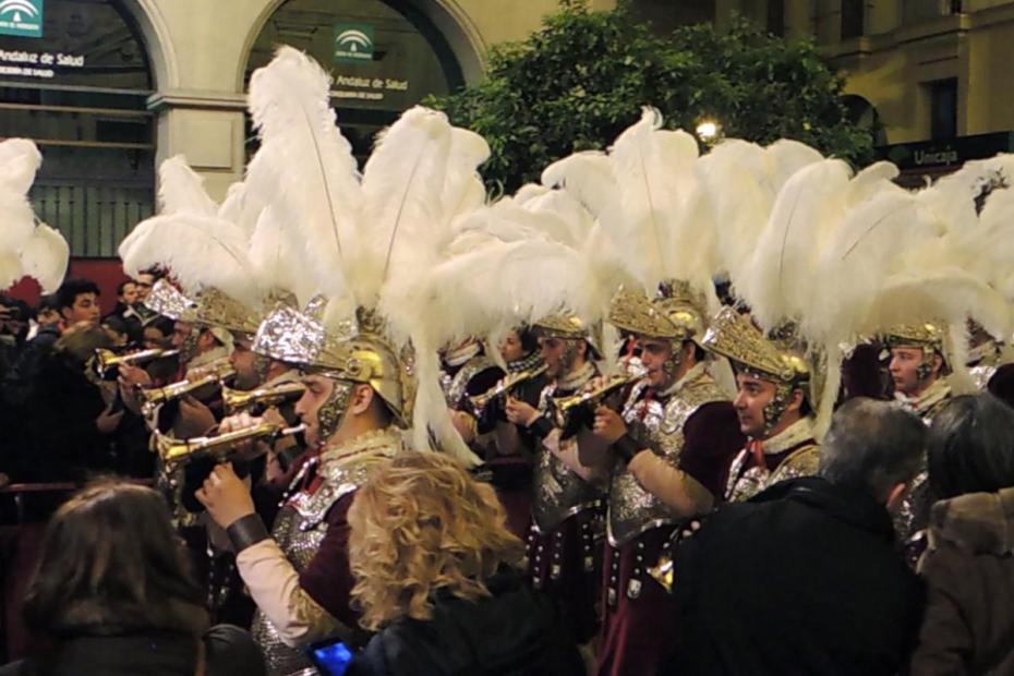 Musicians accompanying La Macarena brotherhood's paso de Cristo are dressed in Roman soldiers' outfits with huge ostrich-plumed headgear.
